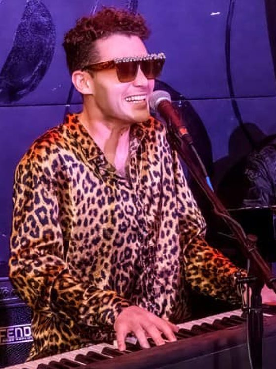 Charlie DiGiovanna playing keys at a gig